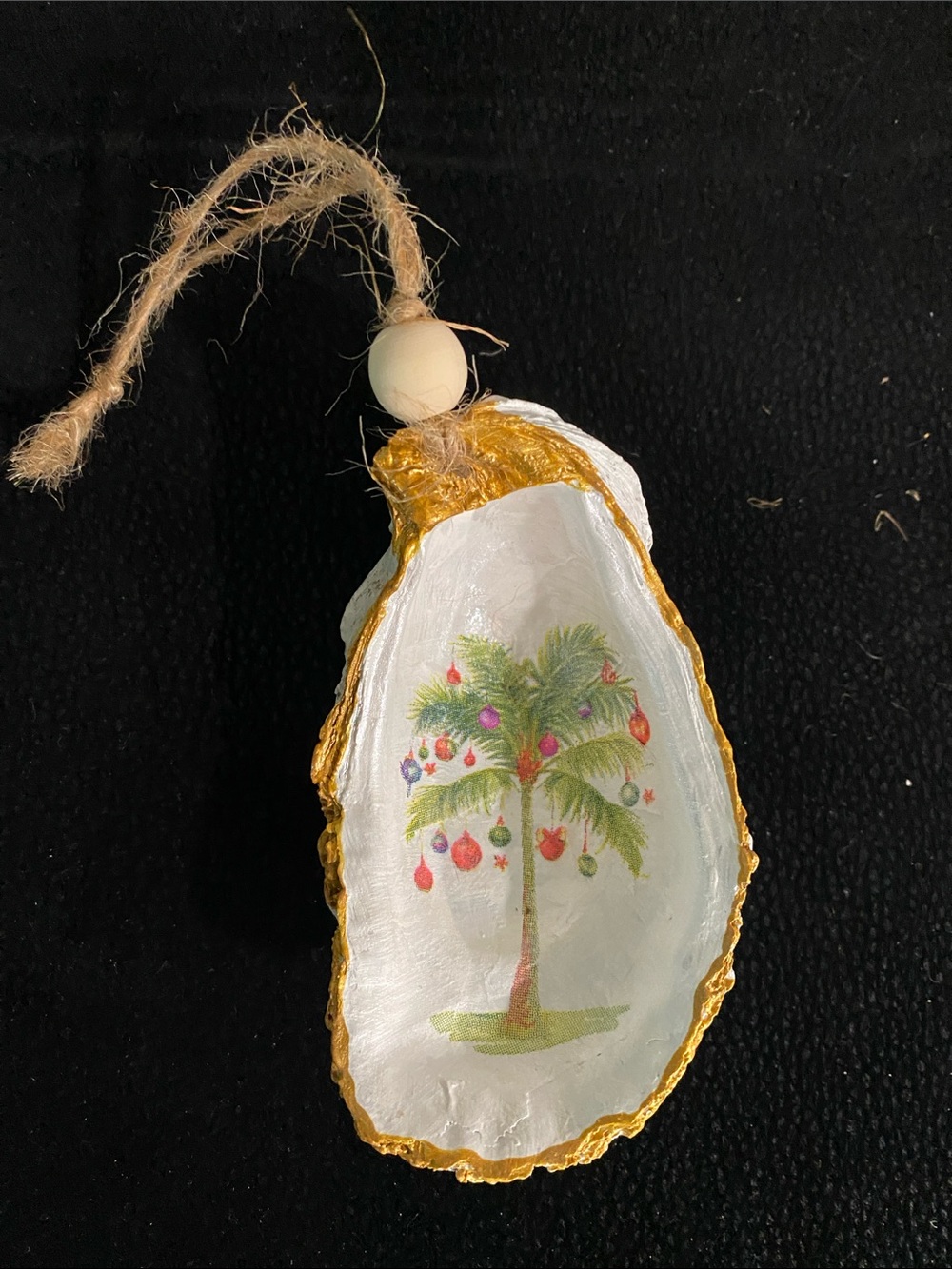 Palm oyster shell ornament